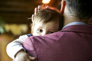 Child being held by father