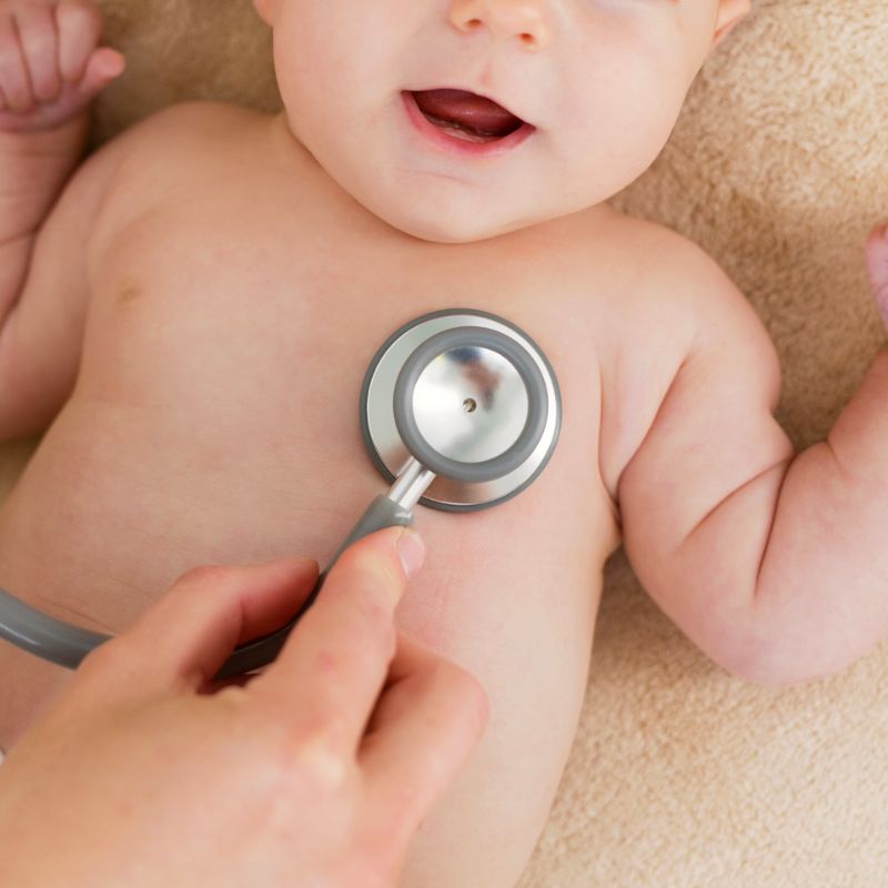 Infant having his heartbeat checked